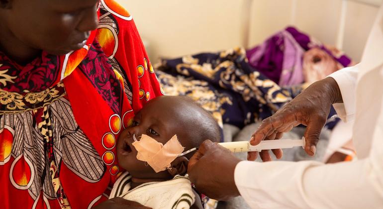 A 6-month-old, malnourished boy in South Sudan receives milk through a feeding tube.  