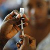 A nurse fills a syringe with a vaccine at the Elmina Urban Health Centre in the Central Region of Ghana. (file)