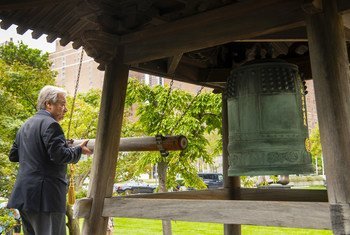 UN Secretary-General António Guterres rings the peace bell at UN Headquarters in New York.