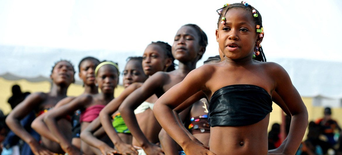 Schoolgirls in Côte d'Ivoire perform as part of activities to raise awareness about peace and human rights.