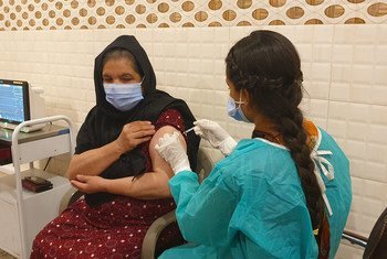 An Afghan refugee is vaccinated against COVID-19 in Rawalpindi in Pakistan.