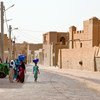Women walk on the street in Timbuktu, Mali.