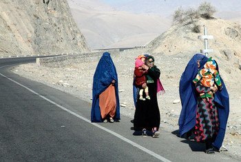 Afghan women walk to Kishm in rural Badakshan.