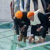 UN Secretary-General António Guterres follows the tradition of washing hands and feet at the shrine in Gurdwara Kartapur Sahib in Punjab province in Pakistan.