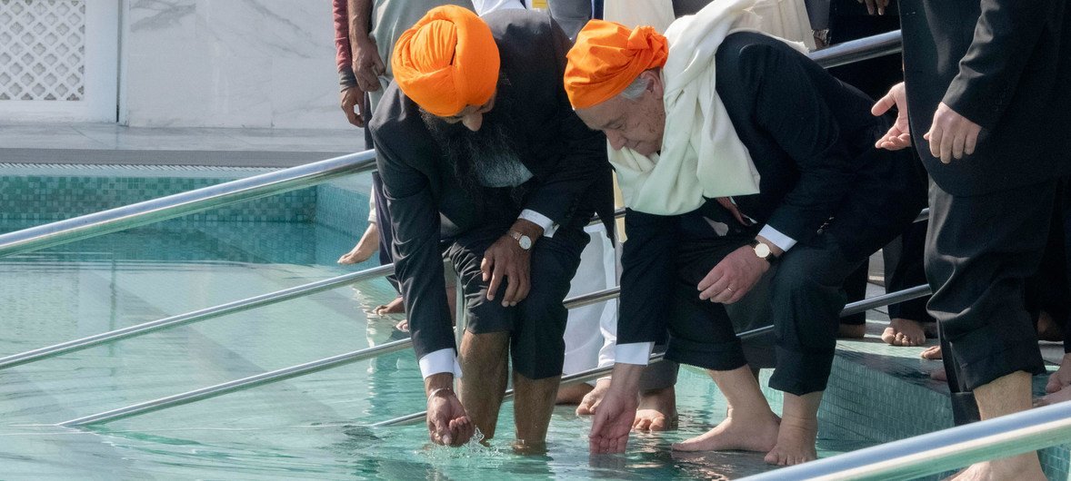 UN Secretary-General António Guterres follows the tradition of washing hands and feet at the shrine in Gurdwara Kartapur Sahib in Punjab province in Pakistan.