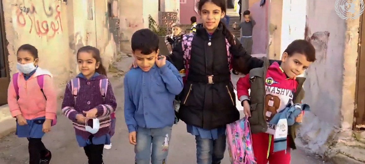 Young Naamat, a Syrian refugee in Jordan, helps take care of her brothers and sisters.
