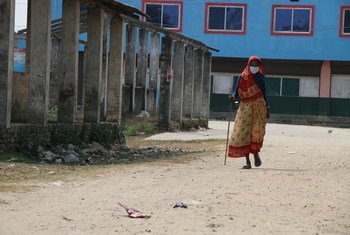 Older women, in particular, face additional challenges and prejudice due to ageist attitudes and discrimination. Pictured here, a 69-year-old woman walks in a village in Nepal.