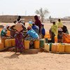 A group of displaced women collect water in the town of Djibo in Burkina Faso.