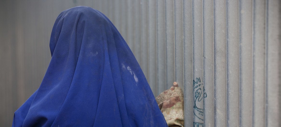 A girl stands in a camp for displaced people, in Mogadishu, the capital. She was attacked and beaten following a food distribution (file).