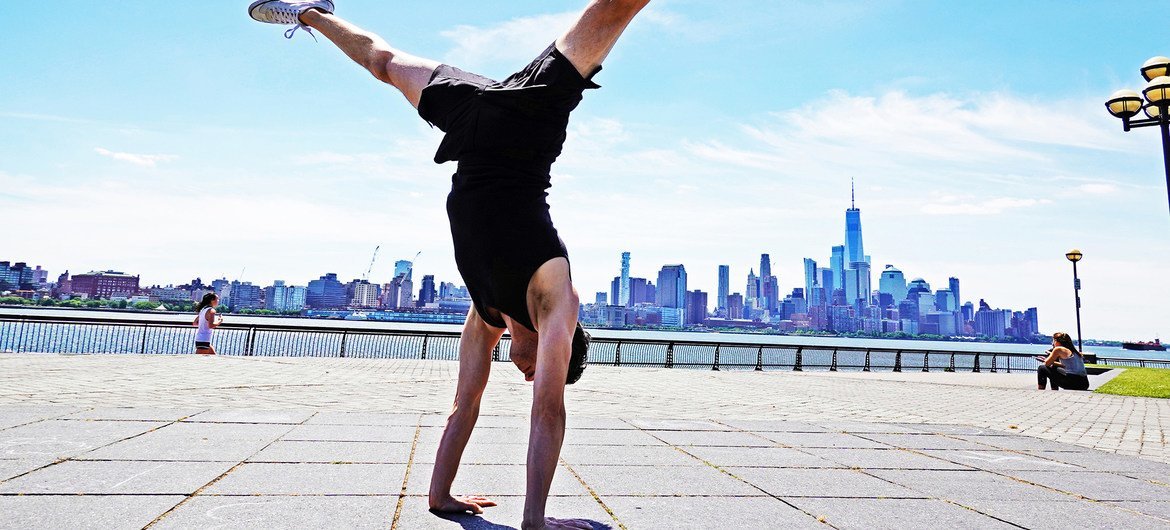 Jon Witt, a yoga teacher, practicing therapeutic yoga postures in Jersey City, USA.