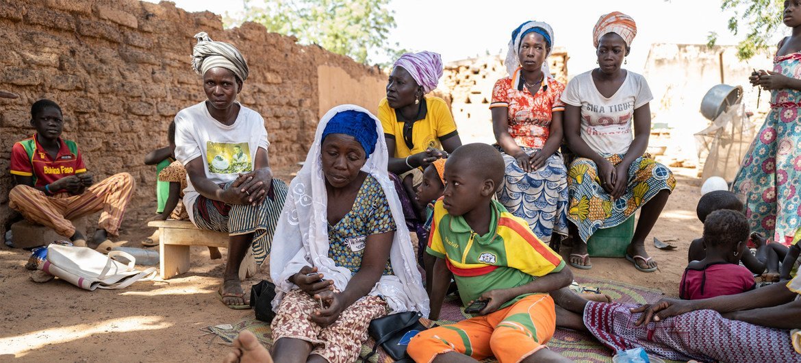 Internally displaced Zeinabou Sawadoga, 42, is surrounded by family in the grounds of her relative’s courtyard in Kaya, Burkina Faso where she is now seeking shelter. 