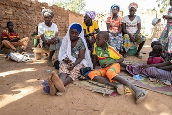 Internally displaced Zeinabou Sawadoga, 42, is surrounded by family in the grounds of her relative’s courtyard in Kaya, Burkina Faso where she is now seeking shelter. 