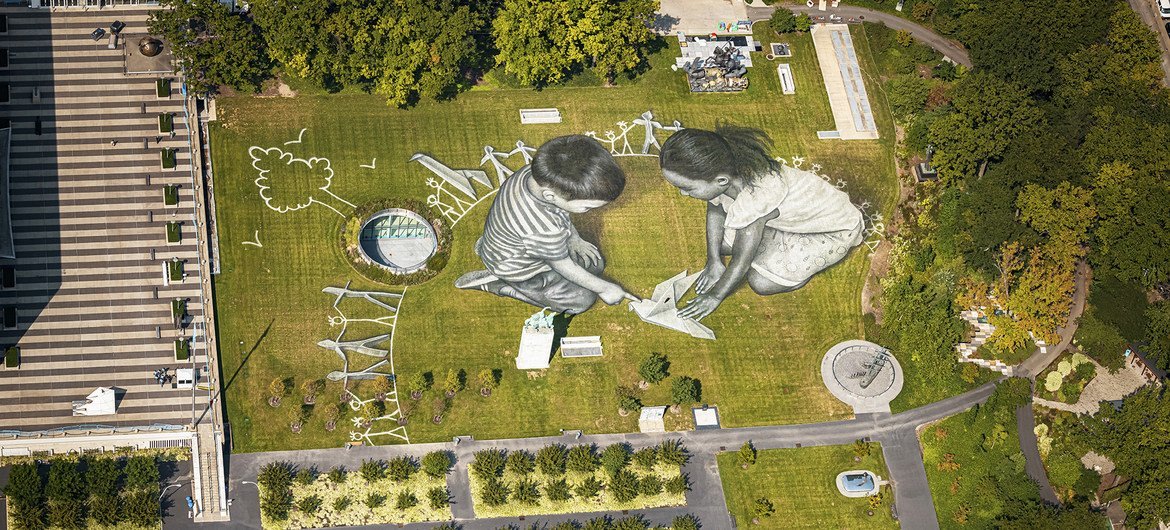 An aerial view over the UN headquarters in NY shows the giant 11,000 square meters (118,000 sq ft) biodegradable ephemeral fresco "Work in Progress II".