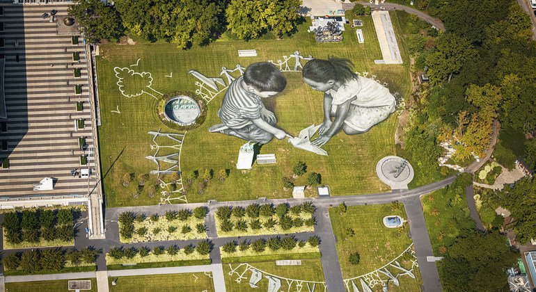 An aerial view over the UN headquarters in NY shows the giant 11,000 square meters (118,000 sq ft) biodegradable ephemeral fresco "Work in Progress II".