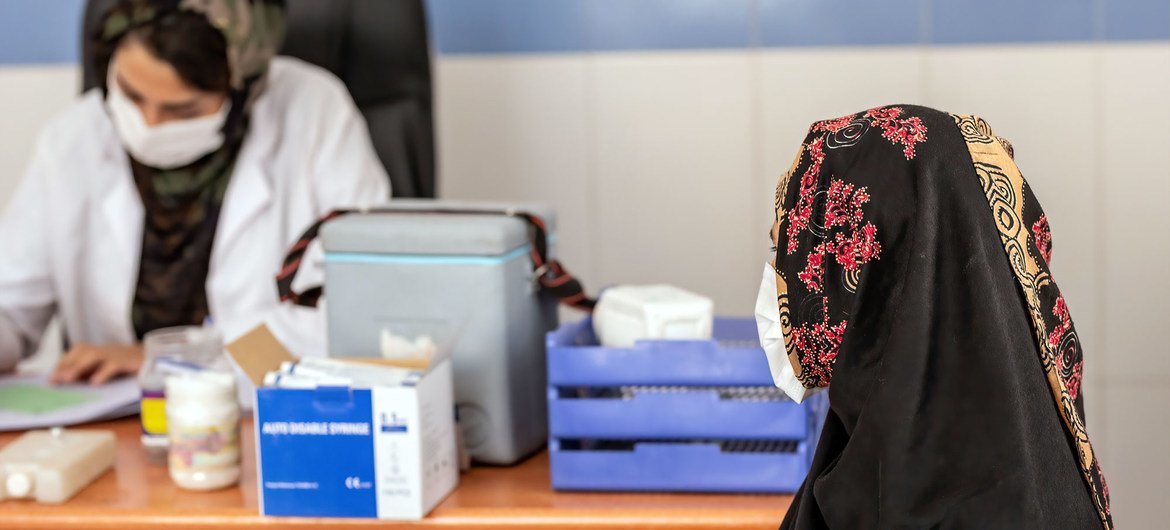 An woman attends a consultation before receiving her COVID-19 vaccination in Herat city, Afghanistan. (file)