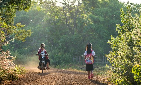 Kres village, Cambodia. 11-year old Loul Bopha makes the short walk from her home to the school