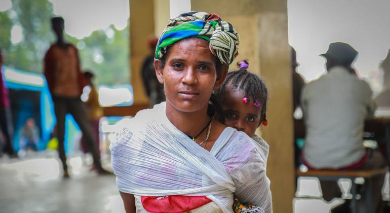 A displaced woman carries her baby in Mekelle, capital of Tigray, Ethiopia.