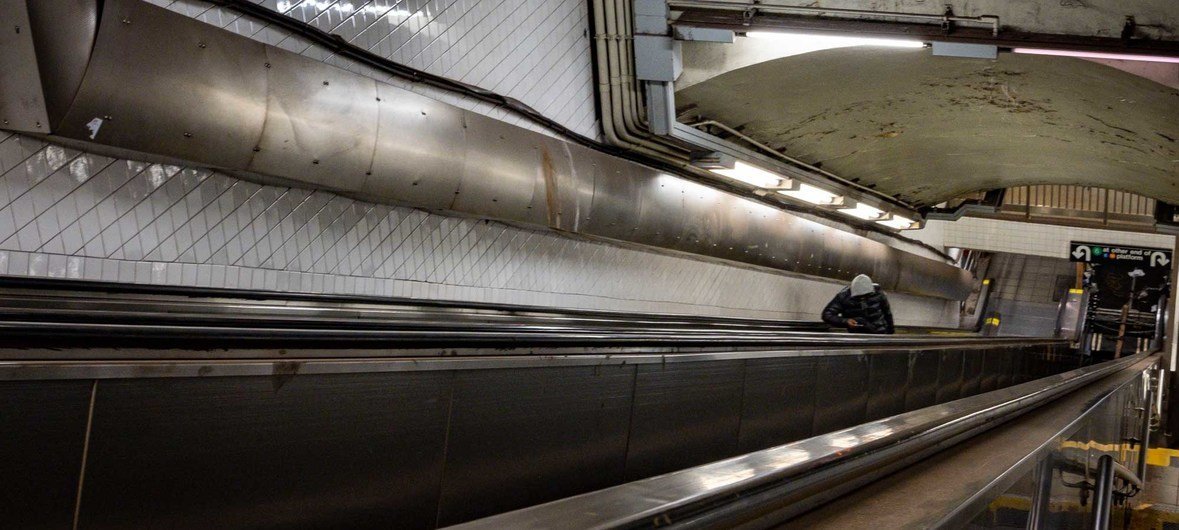 A lone passenger rides an escalator on the New York City subway at one of the network's busiest stations. The city's tourist industry is likely to be decimated by COVID-19 for the rest of 2020.