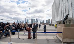 Secretary-General António Guterres briefs reporters on  the situation in Ukraine at a podium in front of the the knotted gun Non-Violence sculpture at UN Headquarters in New York.
