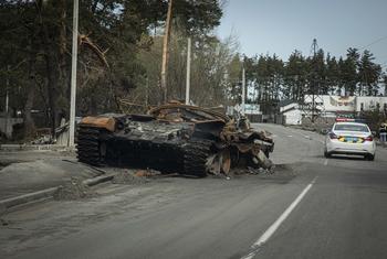 A destroyed tank is abandoned on the road to Bucha, Ukraine.
