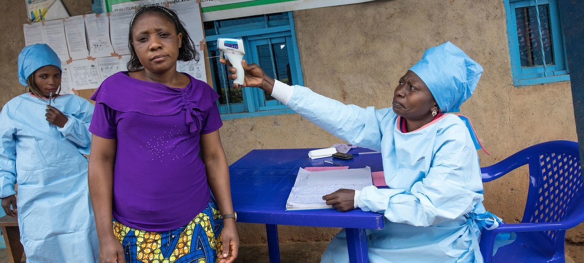 A patient at a health centre in Butembo in the east of the Democratic Republic of the Congo has her temperature measured as part of efforts to prevent the spread of Ebola. (August 2019)