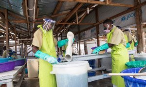 Staff at the Katwa Ebola treatment Unit in Butembo in the east of the Democratic Republic of the Congo disinfect boots and wash clothes. (August 2019)