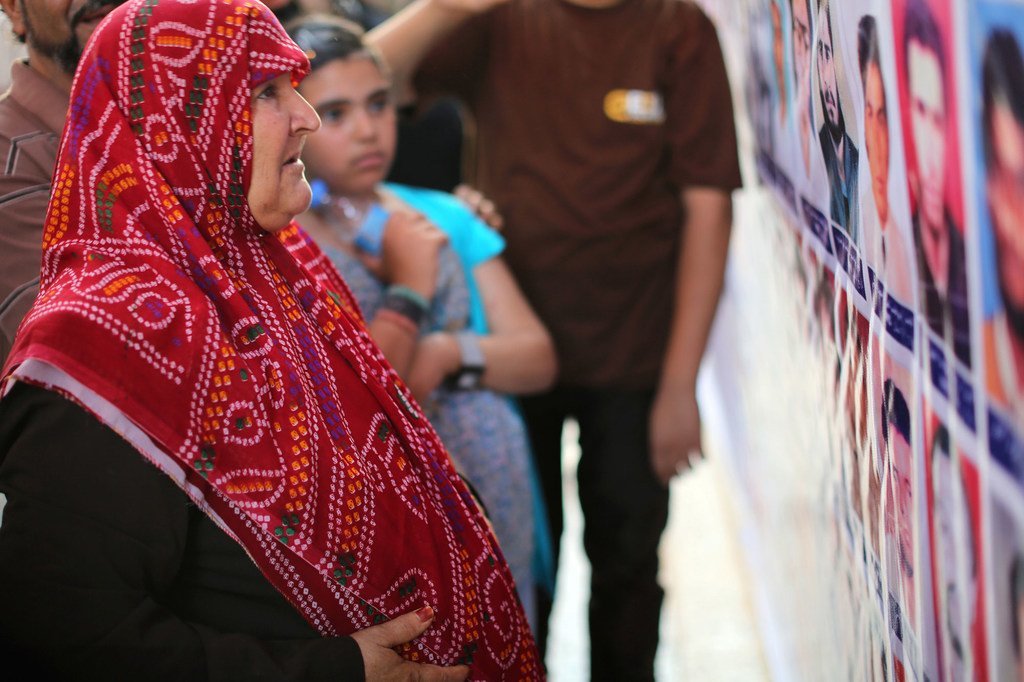 The relative of a prisoner weeps as she identifies his picture at a ceremony commemorating the anniversary of a 1996 massacre in which around 1,200 inmates were shot dead by their guards. (archive)