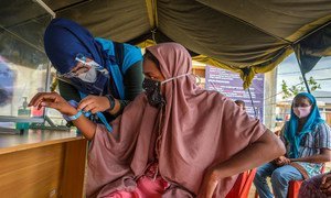 After a seven-month ordeal at sea, a Rohingya refugee is registered at a site in Aceh province, Indonesia.