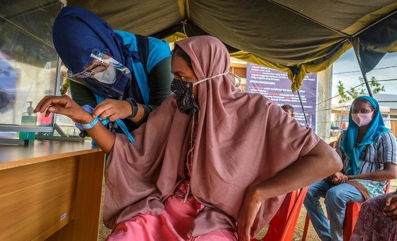 After a seven-month ordeal at sea, a Rohingya refugee is registered at a site in Aceh province, Indonesia.