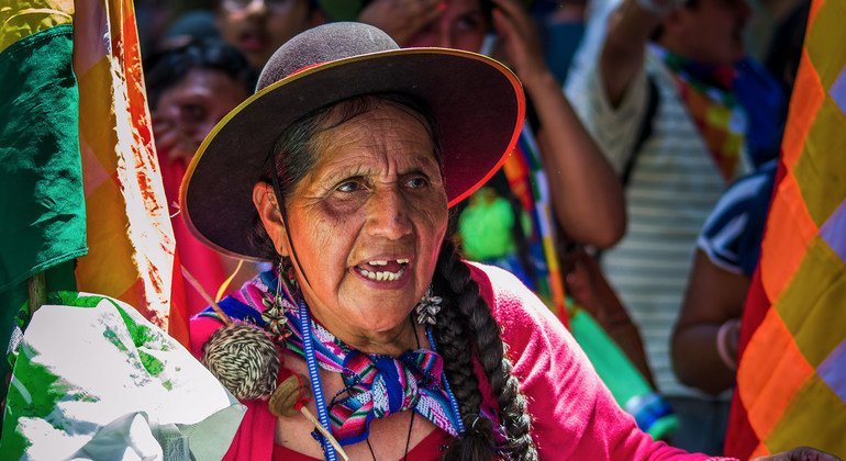 A woman from an indigenous group in Argentina participates in a protest for human rights.