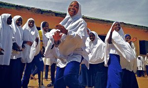 Schoolgirls in Nigeria enjoy a break from class.
