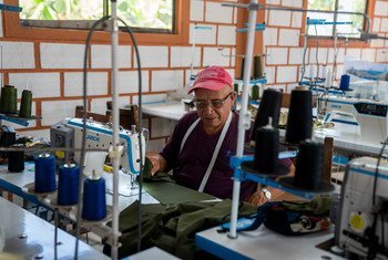 Ex-FARC combatant Efrain Zapata Jaramillo works in a tailor shop as part of a process to return to a life without conflict in Colombia.