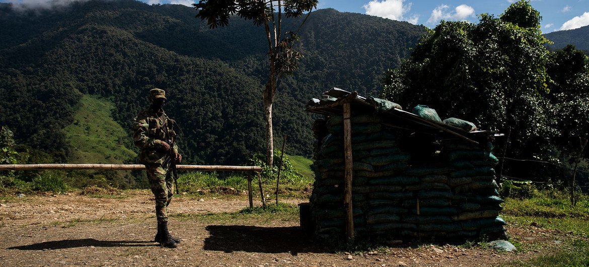 A soldier stands in a former FARC guerilla camp in Dabeiba, Colombia.