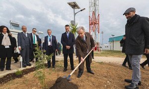 Secretary-General António Guterres plants a tree in the Green Village at the United Nations Global Service Centre (UNGSC) in Brindisi, Italy.