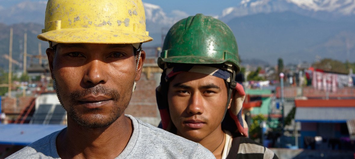 Two workers on a construction site in Pokhara, Nepal.