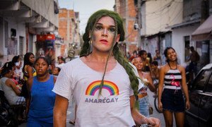 Shout out in the Favela da Maré, in Rio de Janeiro, Brazil.  The t-shirt reads 'Amarégay" -- a pun using the name of the favela, meaning both 'to love is gay' and 'Maré is gay'.