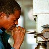 Worker doing maintenance in Mozambique.