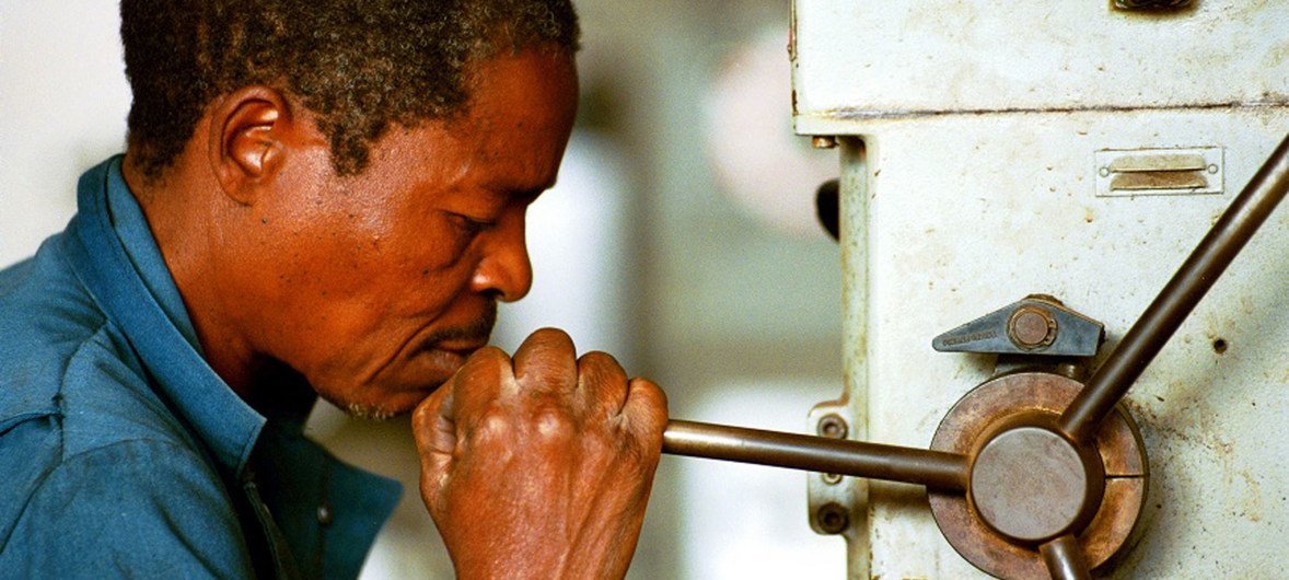 Worker doing maintenance in Mozambique.