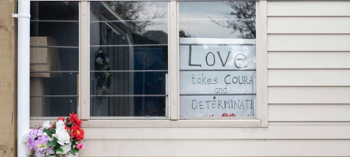 A  sign reads "Love takes courage and determination" at the Linwood Islamic Centre in Christchurch, New Zealand. The Centre was the second of two sites attacked by terrorists on 15 March 2019.