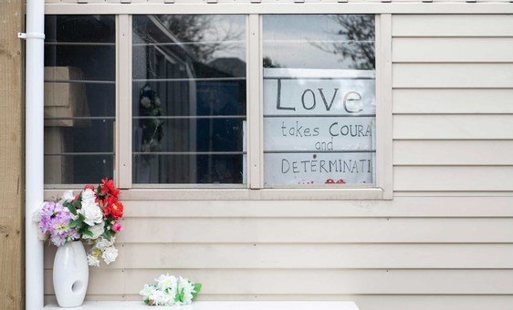 A  sign reads "Love takes courage and determination" at the Linwood Islamic Centre in Christchurch, New Zealand. The Centre was the second of two sites attacked by terrorists on 15 March 2019.