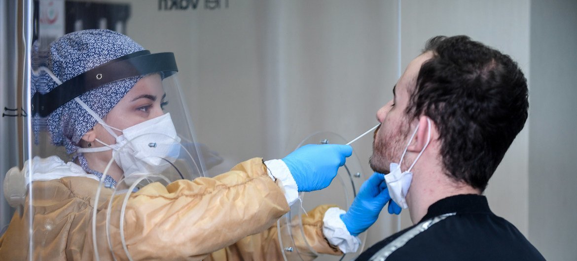 A healthcare worker at a testing facility collects samples for the coronavirus at Mimar Sinan State Hospital, Buyukcekmece district in Istanbul, Turkey.