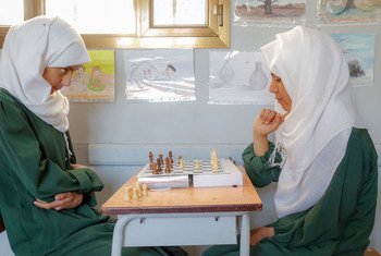 Teenage girls play chess at school in Sana'a, Yemen.