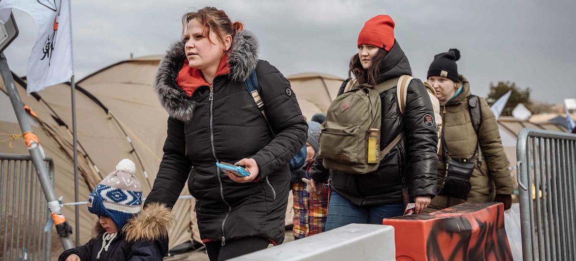 Ukrainian refugees arrive at the Medyka border point in Poland.