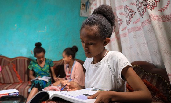 An Ethiopian girl studies at home to combat the spread of COVID-19.