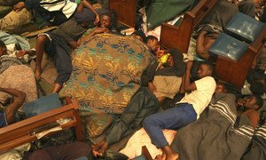Zimbabwean men settle down for the night inside a church in central Johannesburg. The church provides shelter to Zimbabwean refugees. (file)