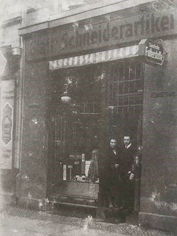Holocaust survivor Freddy Glatt's parents in front of their sewing shop in Berlin. Freddy survived the war and settled in Rio de Janeiro.