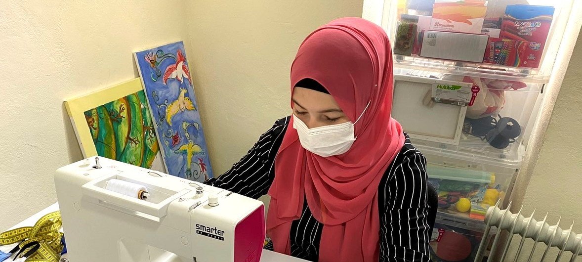 Refugees and migrants at reception centres in Bosnia are sewing masks for use by others at the centre. 