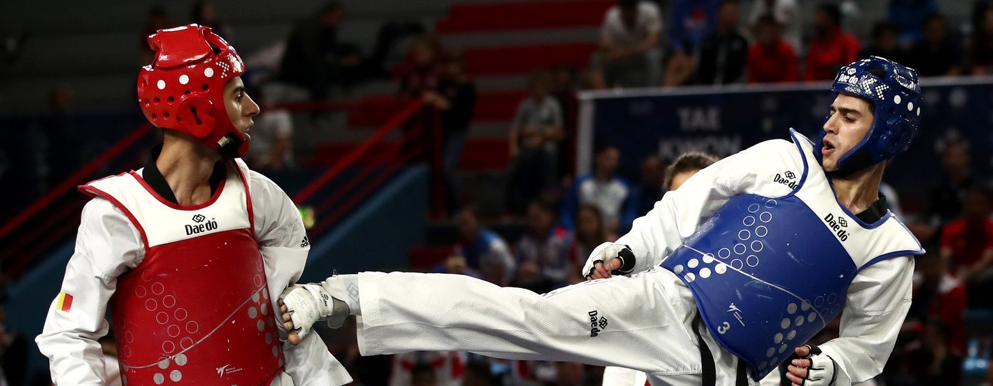 Refugee athlete Ehsan Naghibzadeh (R) in action during the 2019 Taekwondo G4 Extra European Championship