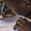 A  14 year-old former child soldier draws at a school in Ndenga village, Kaga Bandoro, Central African Republic. (file)
