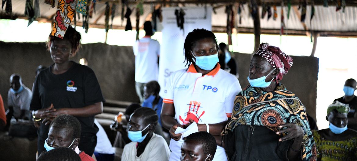 Rose Mary Tiep, a South Sudanese refugee in Omugo II Refugee Settlement, Uganda, translates for a fellow community member 